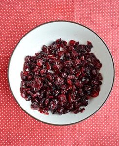 A bowl of dried cranberries in rum.