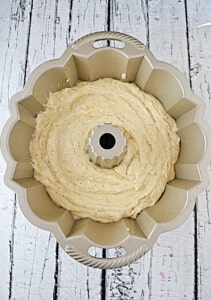 A Bundt pan with cake batter in it.