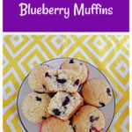 Pin Image: Text title, a plate of lemon blueberry muffins with a muffin split in half in the middle.