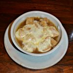 French Onion Soup topped with homemade croutons and Swiss Cheese
