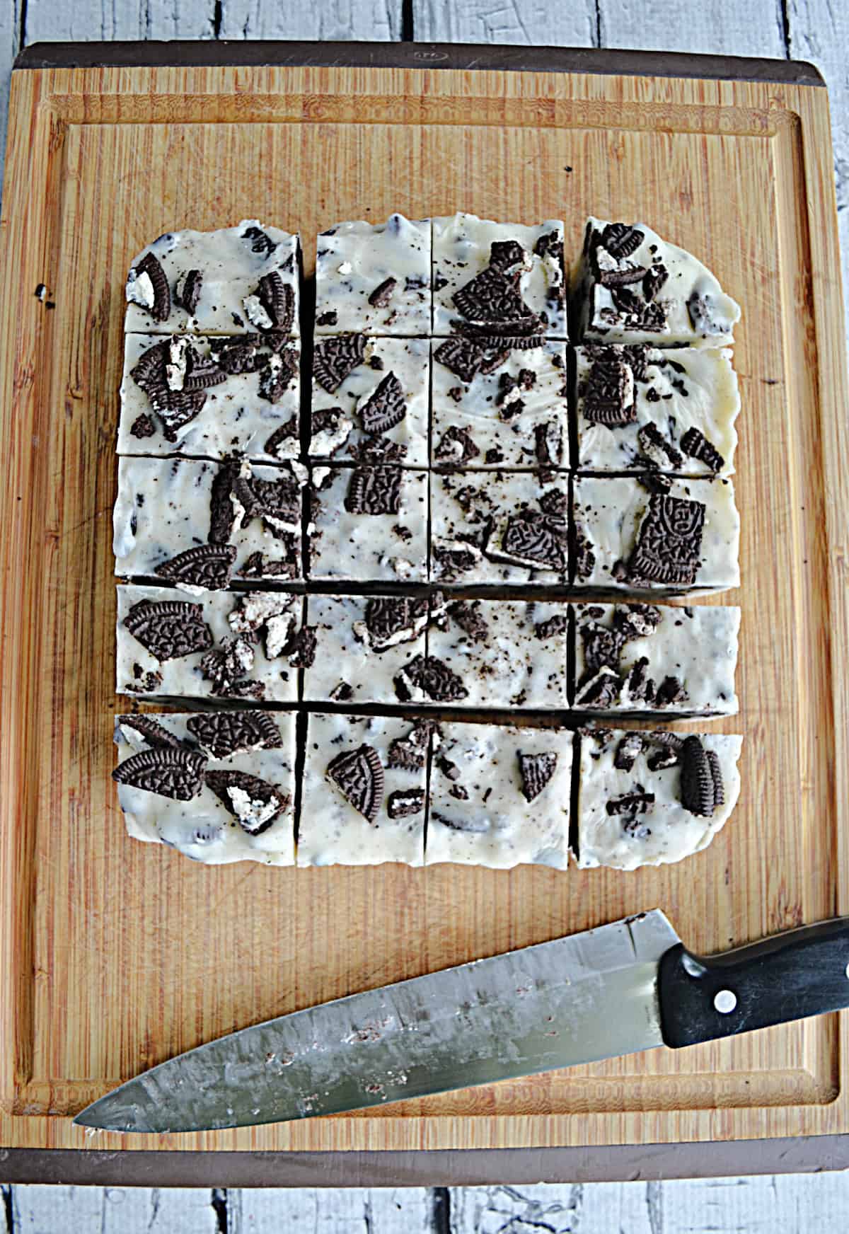 OREO fudge cut into squares with the knife below the fudge.