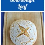 Pin Image: Text, A loaf of sourdough bread with an X scored on top.