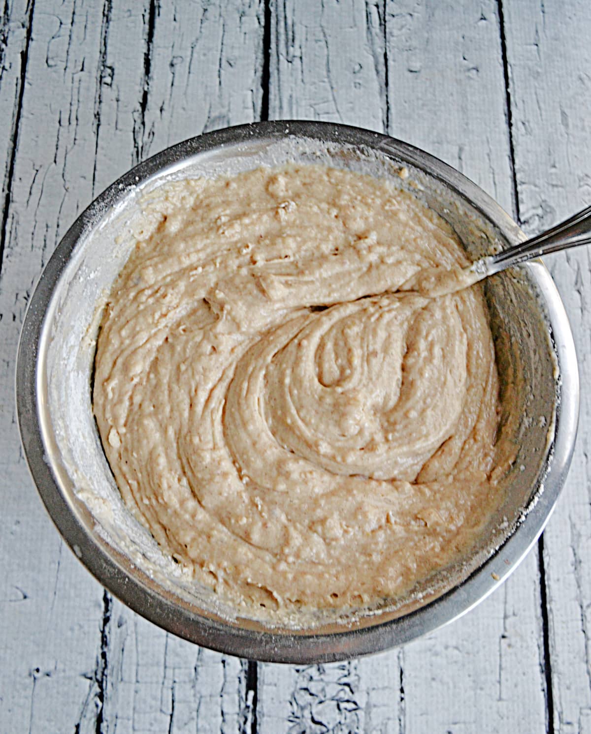 A bowl of apple cake batter.