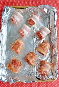 A pan of bacon wrapped meatballs.