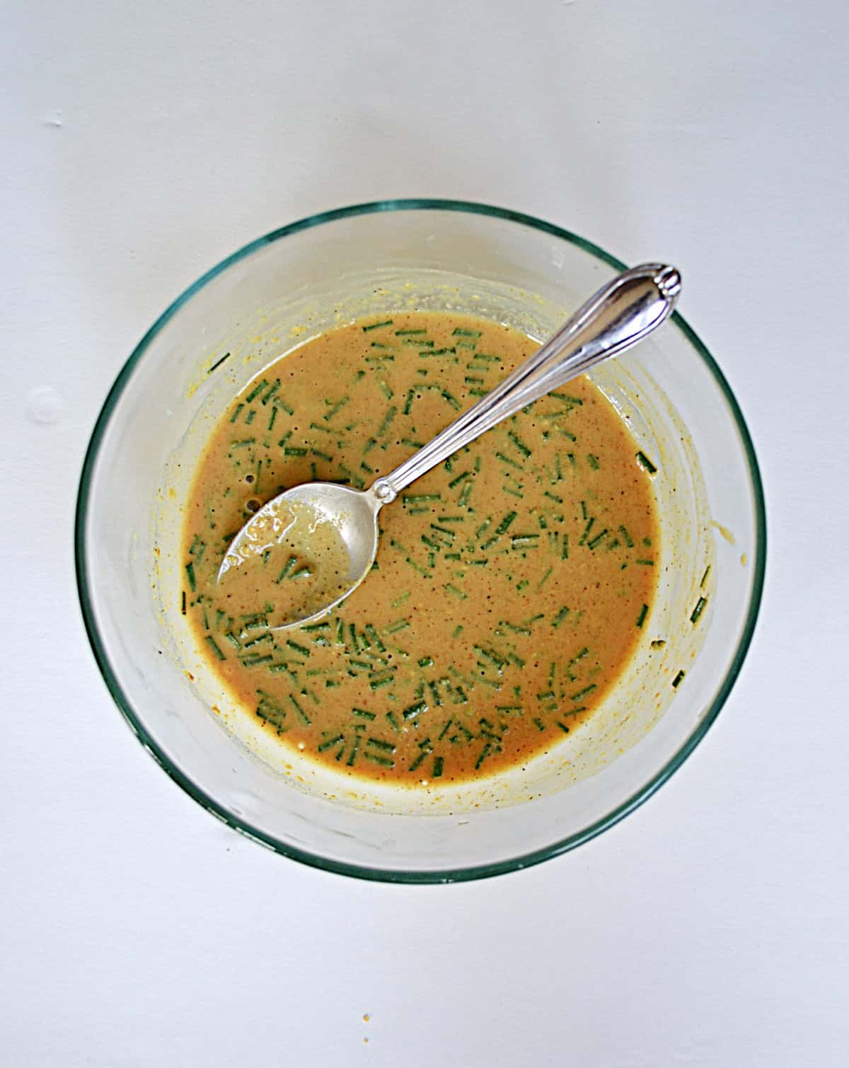 A bowl of warm mustard vinaigrette.