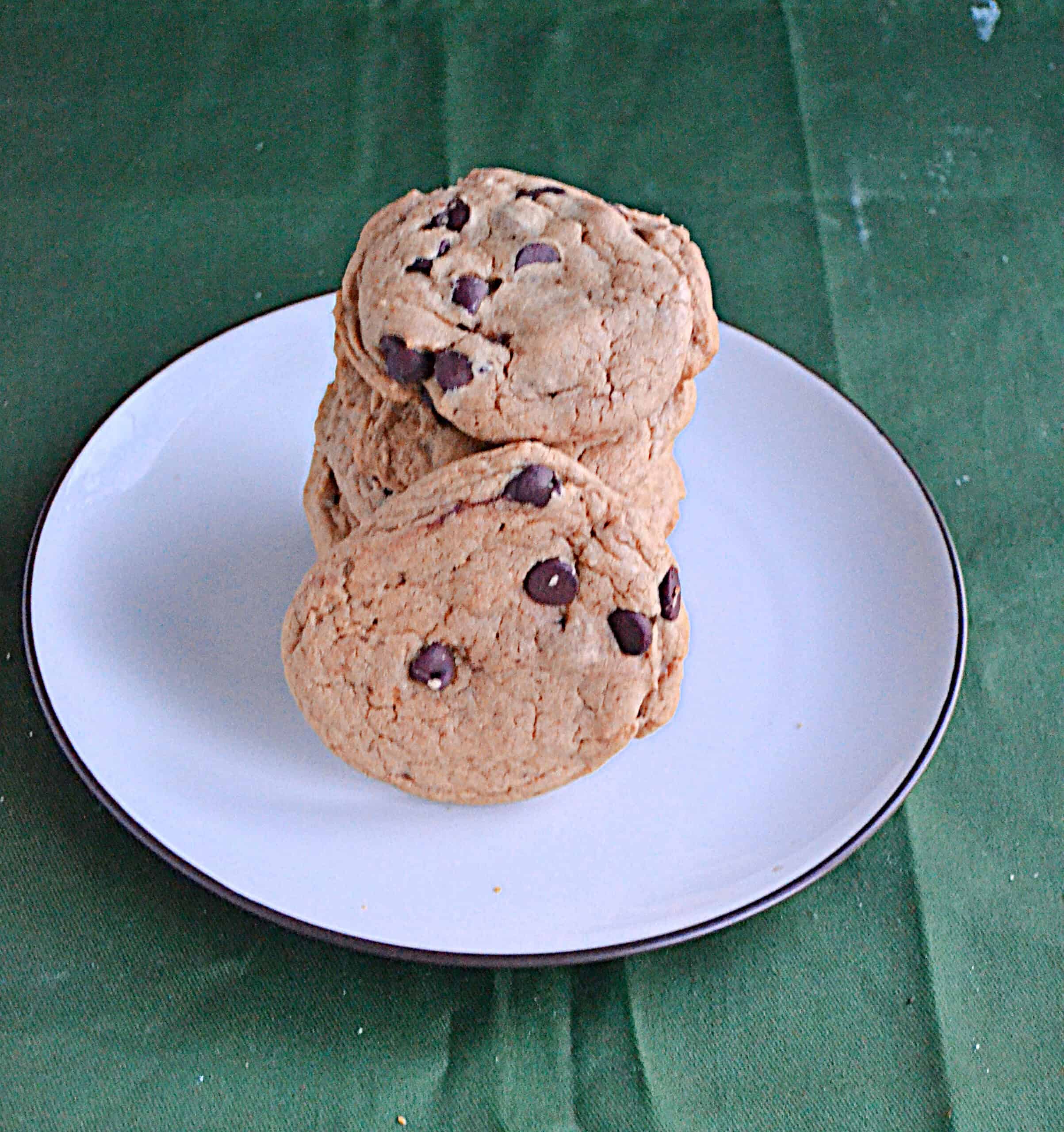 A stack of chocolate chip cookies on a plate.