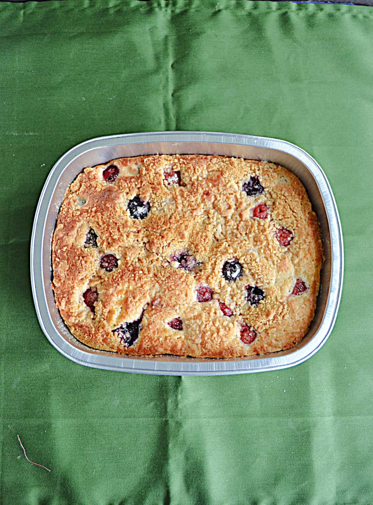 A pan of golden brown cherry coffee cake.