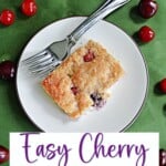 Pin Image: A plate with a piece of cherry coffee cake and a fork with cherries surrounding the plate, text title.