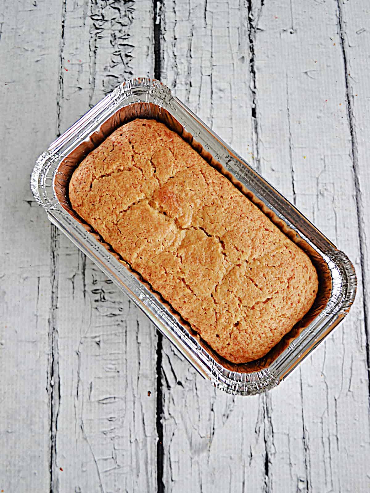 A pumpkin loaf cake in a pan.