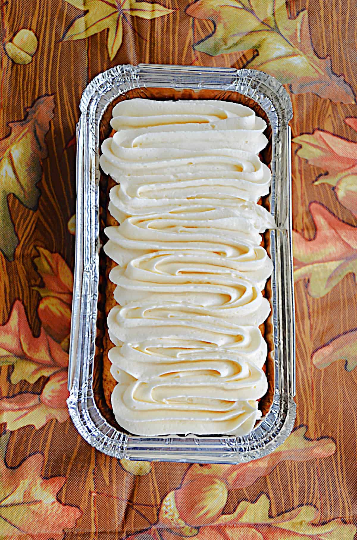 A loaf cake with frosting on it.